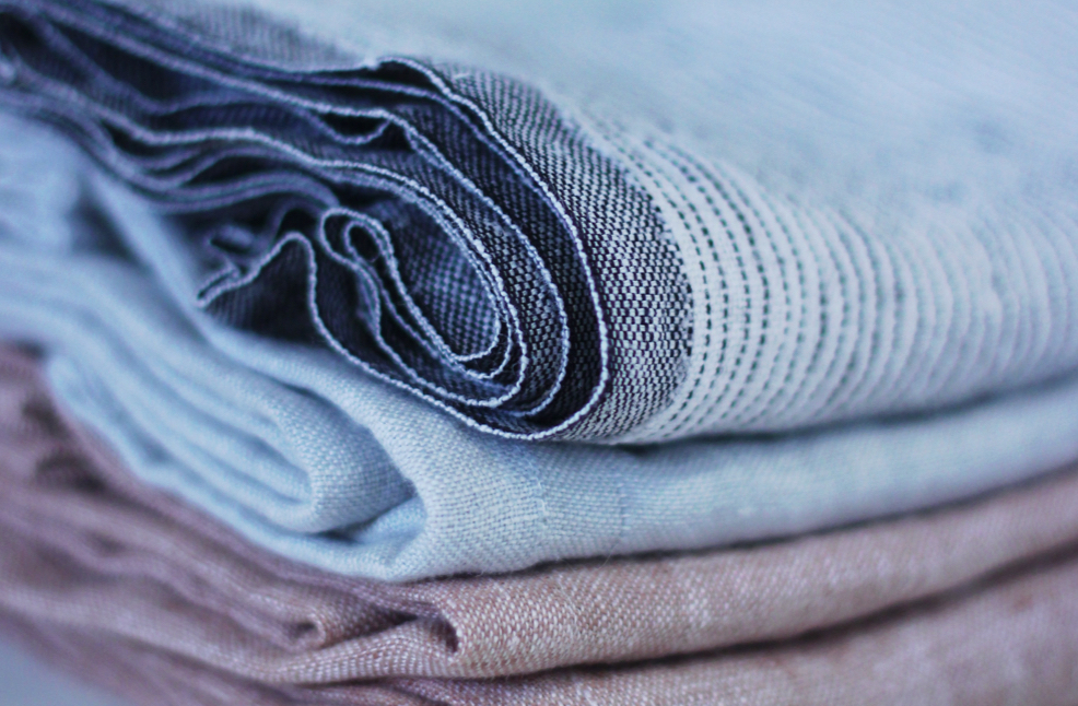 A close up picture of a stack of folded cloth.